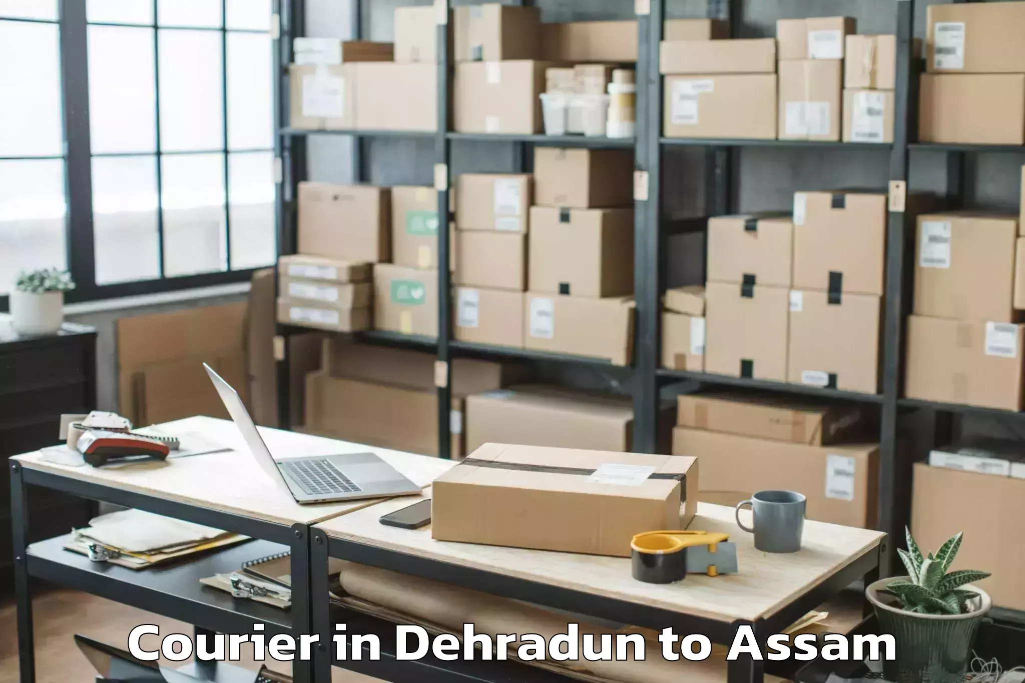 Easy Dehradun to Agomani Courier Booking